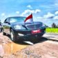 Mobil sedan yang dinaiki Presiden Joko Widodo terlihat melintasi Jalan Terusan Ryacudu, Kota Baru, Jati Agung, Lampung Selatan, Biro Pers Sekretariat Presiden